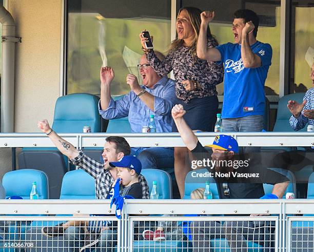 Rob McElhenney, Axel Lee McElhenney and Leo Grey McElhenney attend a baseball game between the Washington Nationals and Los Angeles Dodgers at Dodger...
