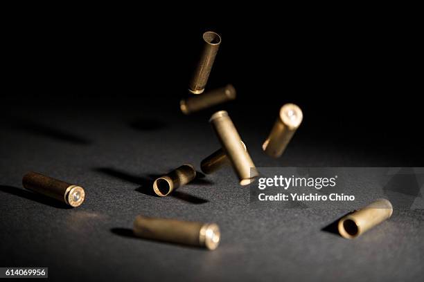 bullets falling on ground - bullet speeding stock pictures, royalty-free photos & images