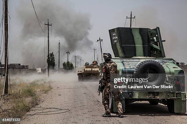 The 5th of JUNE 2016."nA man of the Anbar Police forces, who joined the Golden Division on his advance to Fallujah. IS fighters digged booby-trapped...