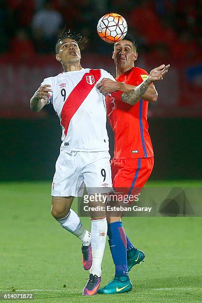 Enzo Roco of Chile fights for the ball with Paolo Guerrero of Peru during a match between Chile and Peru as part of FIFA 2018 World Cup Qualifier at...