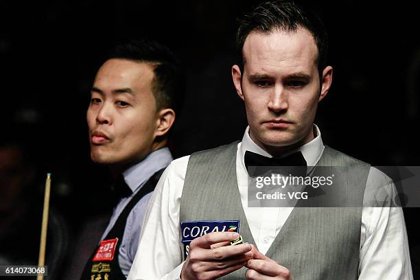 Martin O'Donnell of England reacts during the first round match against Marco Fu of Chinese Hong Kong on day two of the Coral English Open 2016 at...