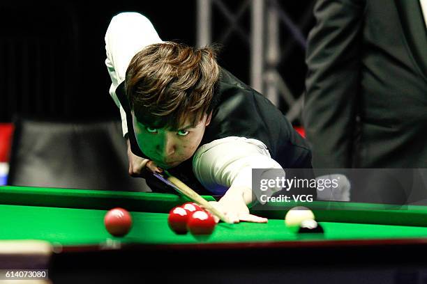 Xiao Guodong of China plays a shot during the first round match against Michael Holt of England on day two of the Coral English Open 2016 at Event...