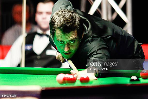 Ronnie O'Sullivan of England plays a shot during the first round match against Jimmy Robertson of England on day two of the Coral English Open 2016...