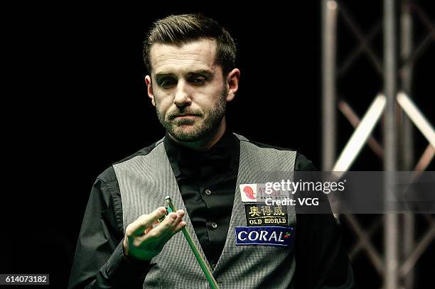 Mark Selby of England reacts during the first round match against Gary Wilson of England on day two of the Coral English Open 2016 at Event City on...