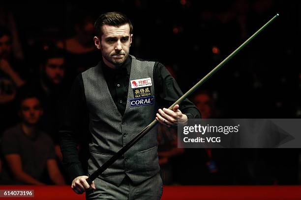 Mark Selby of England reacts during the first round match against Gary Wilson of England on day two of the Coral English Open 2016 at Event City on...