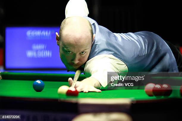 Gary Wilson of England plays a shot during the first round match against Mark Selby of England on day two of the Coral English Open 2016 at Event...