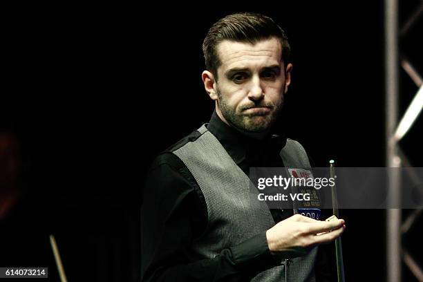 Mark Selby of England reacts during the first round match against Gary Wilson of England on day two of the Coral English Open 2016 at Event City on...