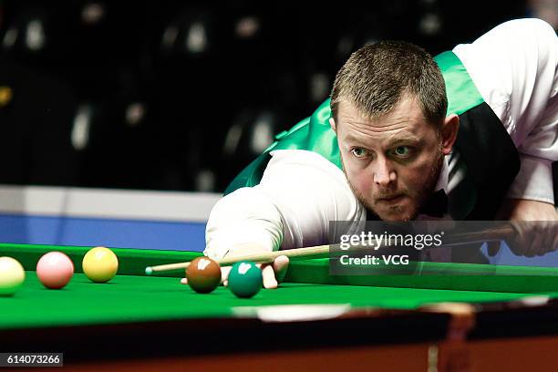 Mark Allen of Northern Ireland plays a shot during the first round match against Jamie Curtis-Barrett of England on day two of the Coral English Open...