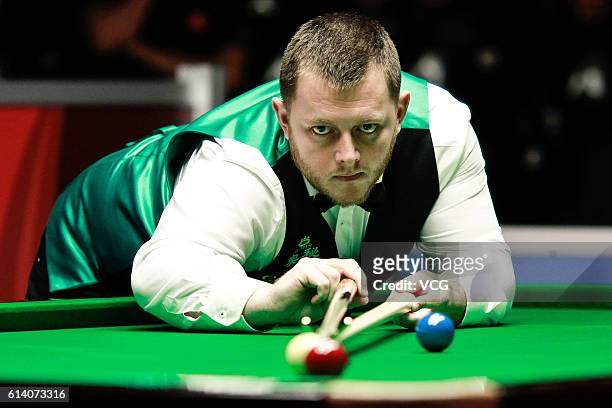 Mark Allen of Northern Ireland plays a shot during the first round match against Jamie Curtis-Barrett of England on day two of the Coral English Open...