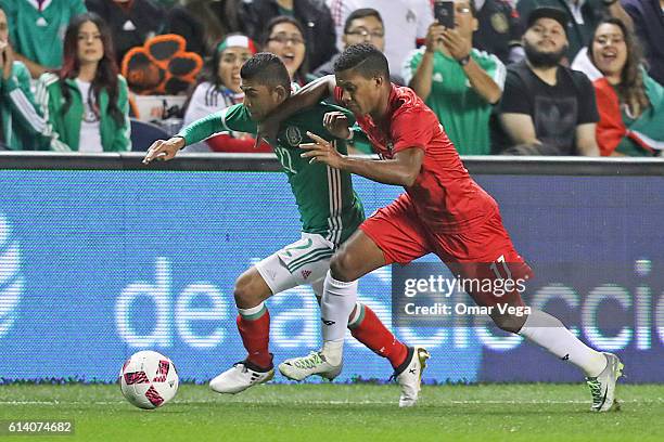 Luis Ovalle of Panama fights for the ball with Orbelin Pineda of Mexico during the International Friendly Match between Mexico and Panama at Toyota...