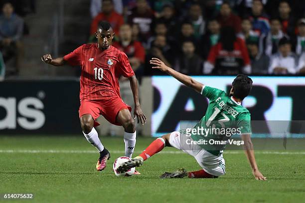 Josiel Nunez of Panama tries to avoid the slide by Erick Gutierrez of Mexico during the International Friendly Match between Mexico and Panama at...