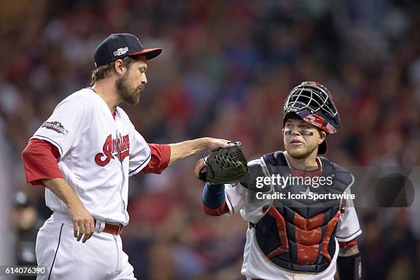 Cleveland Indians Pitcher Andrew Miller [4235] gets a high five from Cleveland Indians Catcher Roberto Perez [10535] during the fifth inning of the...