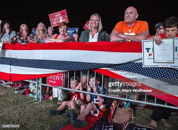 Maddox Smith, left, 5 years old and his 9 year old brother Pearson Smith wait with their parents Kara and Kriss Smith from Knoxville, TN to hear...