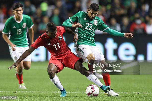 Orbelin Pineda of Mexico fights for the ball with Armando Cooper of Panama during the International Friendly Match between Mexico and Panama at...