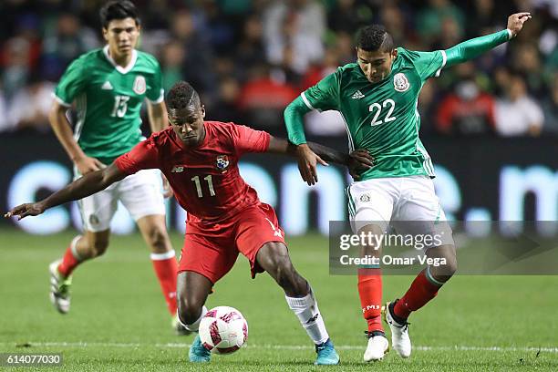 Orbelin Pineda of Mexico fights for the ball with Armando Cooper of Panama during the International Friendly Match between Mexico and Panama at...