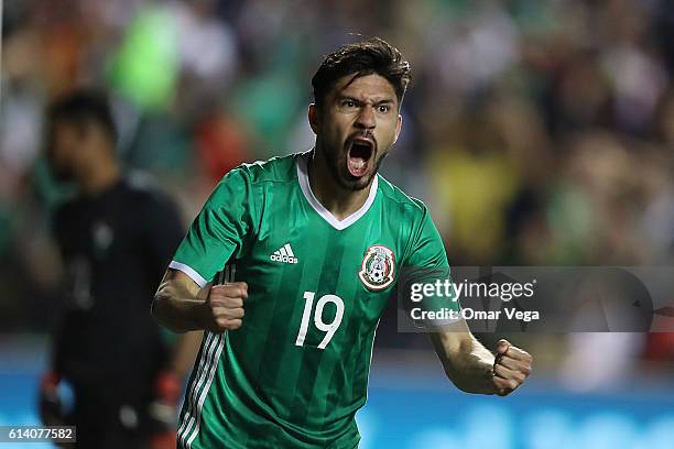 Oribe Peralta of Mexico celebrates after scoring his team's first goal during the International Friendly Match between Mexico and Panama at Toyota...