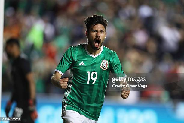 Oribe Peralta of Mexico celebrates after scoring his team's first goal during the International Friendly Match between Mexico and Panama at Toyota...