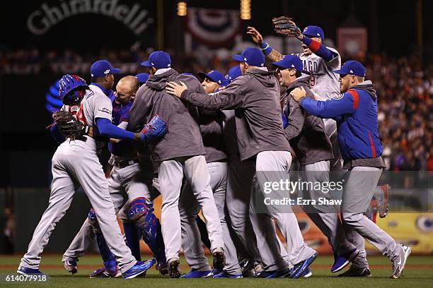 The Chicago Cubs celebrate after defeating the San Francisco Giants 6-5 in Game Four of their National League Division Series to advance to the...