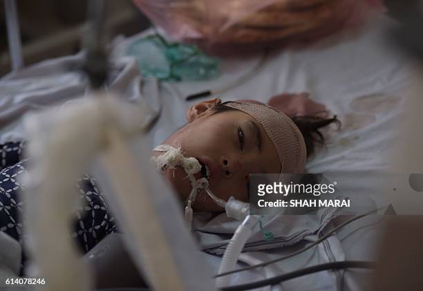 An Afghan wounded girl named Frishta receives treatment at the Ali Abad hospital after an attack by gunmen inside the Karte Sakhi shrine in Kabul on...