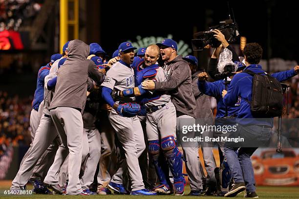 Members of the Chicago Cubs celebrate on the field after defeating the San Francisco Giants in Game 4 of NLDS at AT&T Park on Tuesday, October 11,...