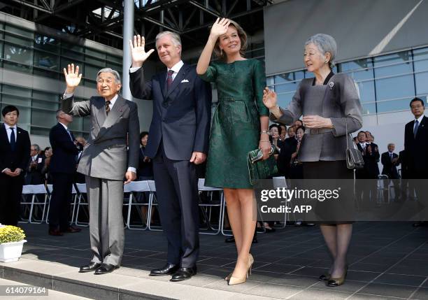 Belgium's King Philippe and Queen Mathilde , Japan's Emperor Akihito and Empress Michiko wave to well-wishers upon their arrival at the Yuki...