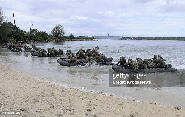 United States - Members of Japan's Ground Self-Defense Force and the U.S. Marine Corps land on the northern shore of the island of Guam during a...