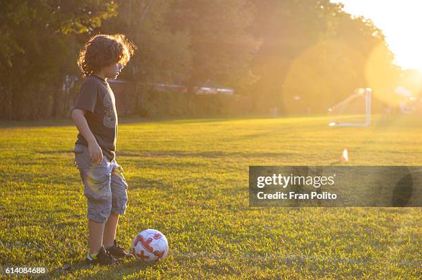 boy playing soccer. - kids event stock pictures, royalty-free photos & images