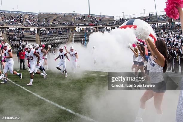 The UConn Huskies take the field prior to the start of a NCAA football game between, AAC rivals, the Cincinnati Bearcats and the UConn Huskies at...