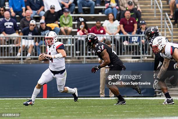 UConn Quarterback Bryant Shirreffs scrambles out of the pocket during the first half of a NCAA football game between, AAC rivals, the Cincinnati...