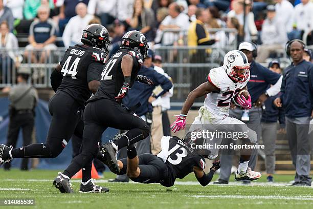 Cincinnati Cornerback Grant Coleman dives to tackle UConn Running Back Arkeel Newsome during the second half of a NCAA football game between, AAC...