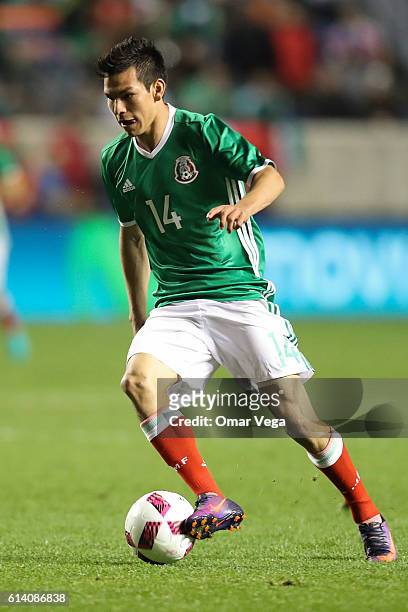 Hirving Lozano of Mexico drives the ball during the International Friendly Match between Mexico and Panama at Toyota Park on October 11, 2016 in...