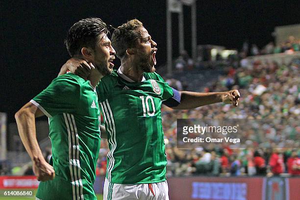 Oribe Peralta of Mexico celebrates with Giovani dos Santos after scoring his team's first goal during the International Friendly Match between Mexico...