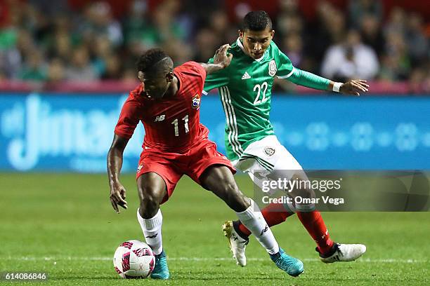 Orbelin Pineda of Mexico fights for the ball with Armando Cooper of Panama during the International Friendly Match between Mexico and Panama at...