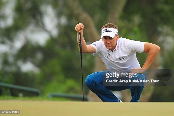 Ian Poulter of England plays a shot during the Pro-Am for the 2016 Venetian Macao Open at Macau Golf and Country Club on October 12, 2016 in Macau,...