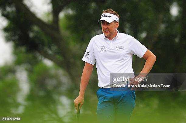 Ian Poulter of England plays a shot during the Pro-Am for the 2016 Venetian Macao Open at Macau Golf and Country Club on October 12, 2016 in Macau,...