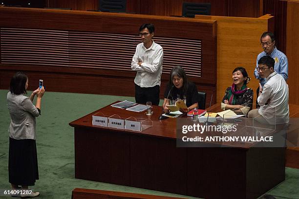 Lawmakers Nathan Law, Fernando Cheung, Claudia Mo, League of Social Democrat legislator Leung Kwok-hung also known as 'Long Hair' and Eddie Chu, are...