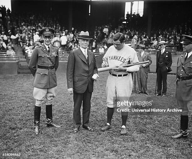Secretary of War James W. Good Watching Babe Ruth of New York Yankees Signing First of Many Bats to be Awarded as Prizes at Citizens Military Camps...