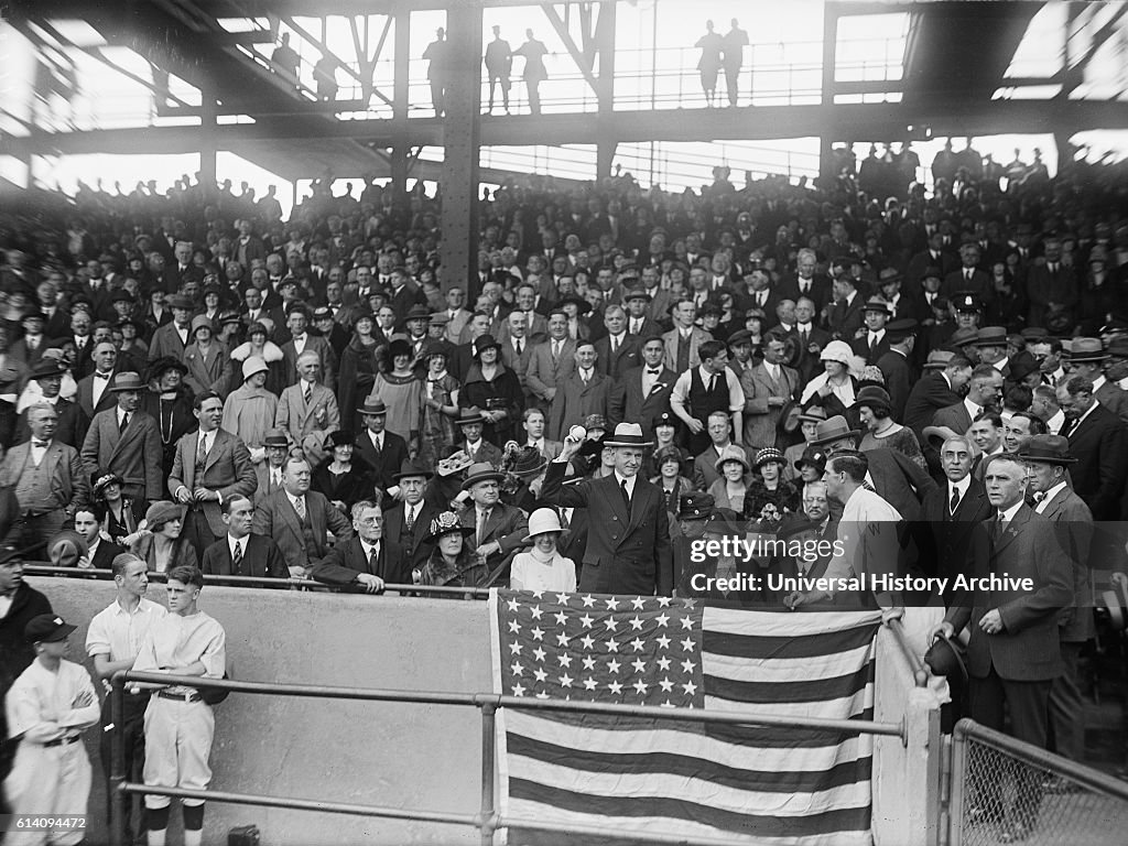 U.S. President Calvin Coolidge Throwing out First Baseball at World Series Game between Washington Senators and New York Giants, Griffith Stadium, Washington DC, USA, circa 1924