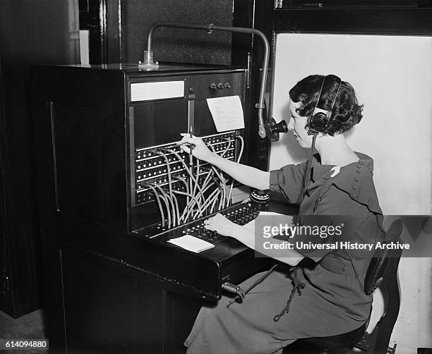 Woman Working at Switchboard, USA, circa 1935.