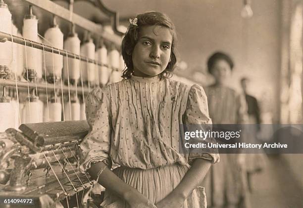 Portrait of Teen Girl Working as Spinner at Cotton Mill, Lancaster, South Carolina, USA, circa 1908.