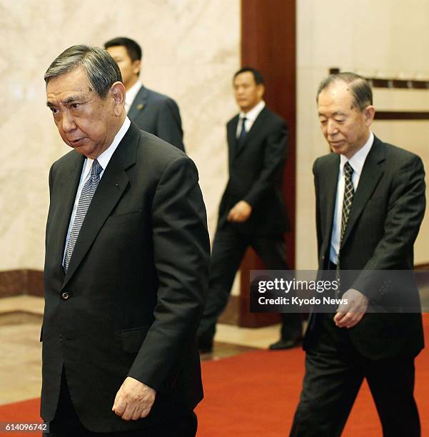 China - Yohei Kono , former Japanese House of Representatives speaker, heads for a meeting with top Communist Party of China official Jia Qinglin at...