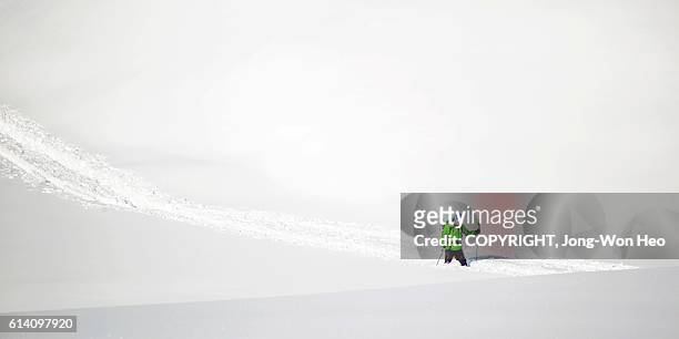 a man who was going through deep snow - pyeongchang stock pictures, royalty-free photos & images