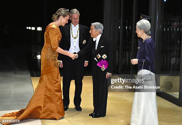 Emperor Akihito and Empress Michiko welcome King Philippe and Queen Mathilde of Belgium prior to the state dinner at the Imperial Palace on October...