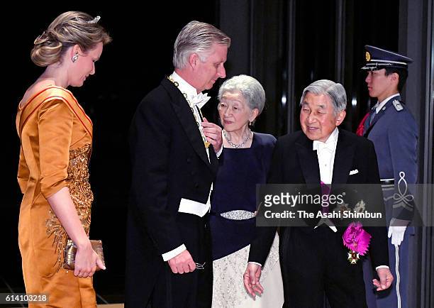 Emperor Akihito and Empress Michiko welcome King Philippe and Queen Mathilde of Belgium prior to the state dinner at the Imperial Palace on October...