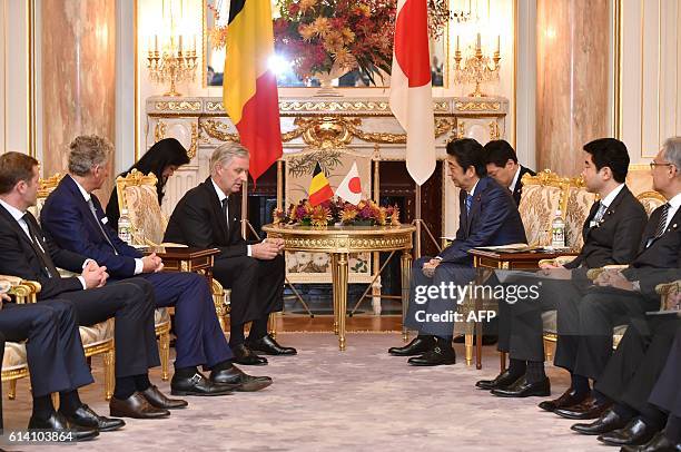 Belgium's King Philippe talks with Japan's Prime Minister Shinzo Abe at the state guest house in Tokyo on October 12, 2016. The Belgian royal couple...