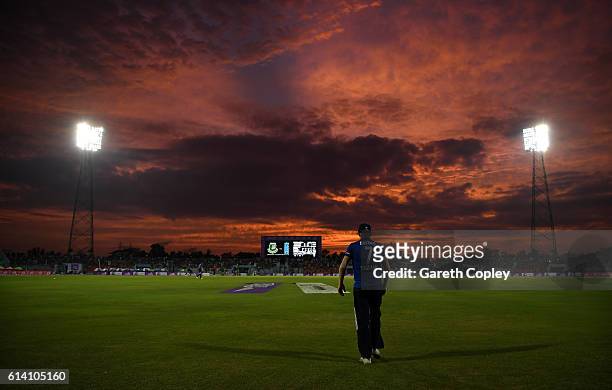 Sam Billings of England fields on the boundary as the sunsets during the 3rd One Day International match between Bangladesh and England at Zohur...
