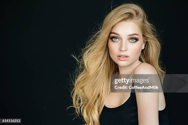 beautiful woman with make-up - blonde hair black background stock pictures, royalty-free photos & images