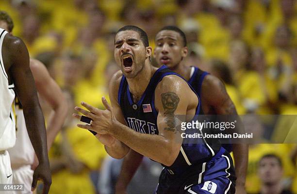 Carlos Boozer of the Duke Blue Devils celebrates during the ACC/Big Ten Challenge against the Iowa Hawkeyes at United Center in Chicago, Illinois on...