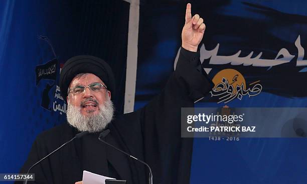 Lebanon's Shiite movement Hezbollah's leader Hassan Nasrallah addresses a crowd during commemorations for Ashura in a southern Beirut suburb on...