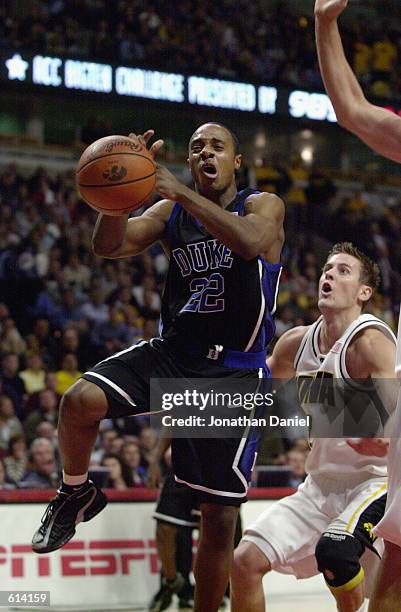 Jason Williams of the Duke Blue Devils drives to the basket during the ACC/Big Ten Challenge against the Iowa Hawkeyes at United Center in Chicago,...